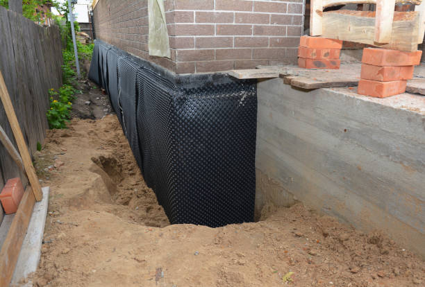 SJ Waterproofing Pros technician performing targeted Basement Waterproofing assessment in Joint Base Mdl, NJ